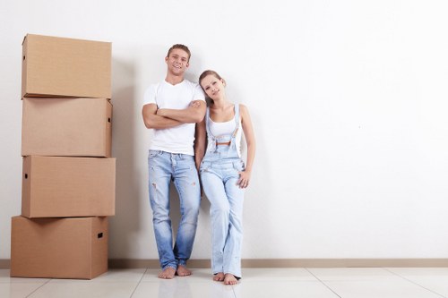 Professional movers handling boxes during a move in Purfleet