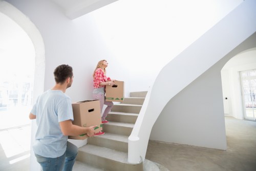 Professional movers handling furniture in West Drayton