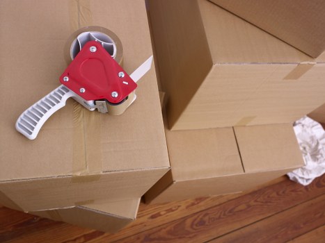 Professional movers handling furniture in Berrylands